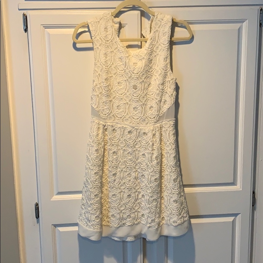 Crocheted flaired white mini dress
